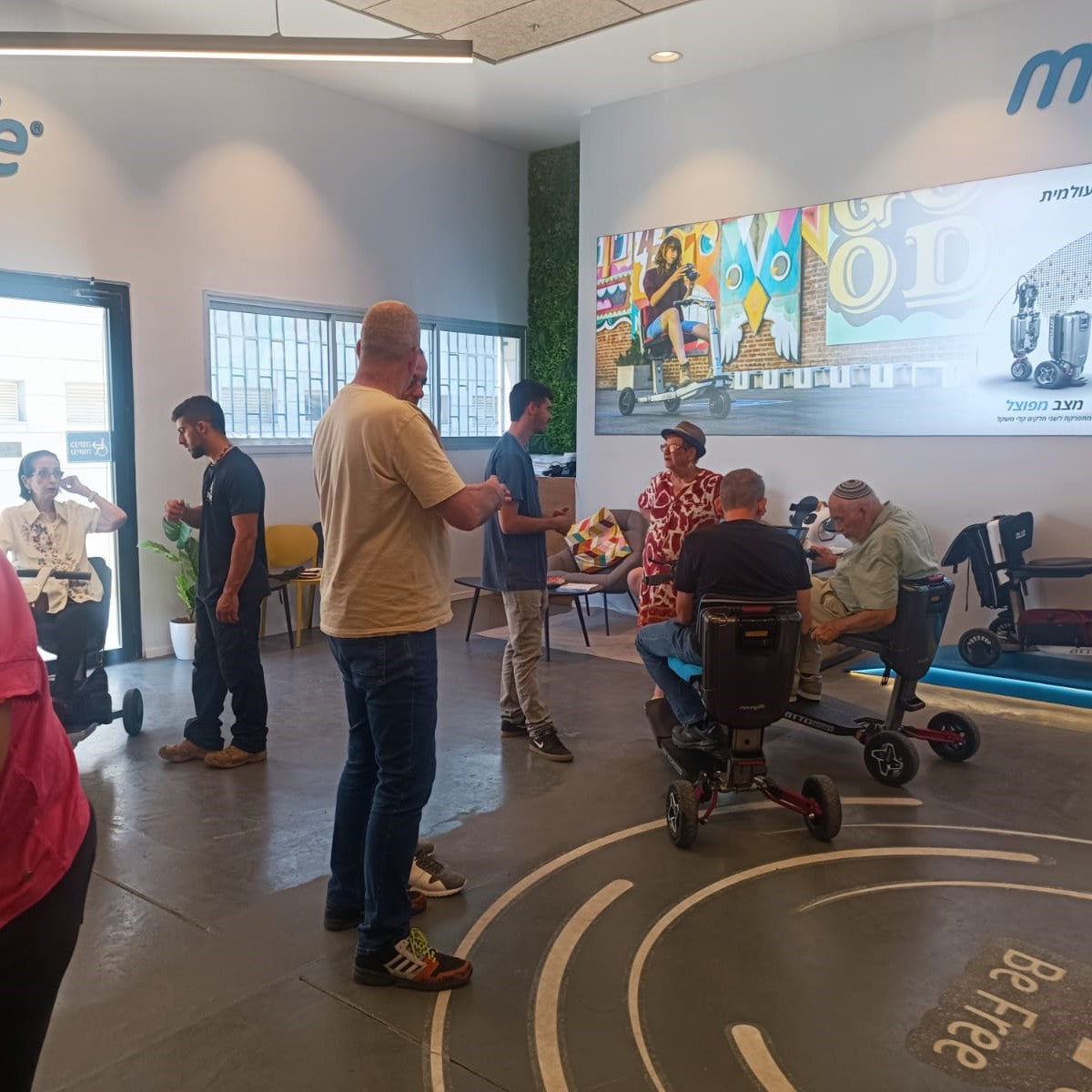 Working with Movinglife mobility scooter clients in our showroom